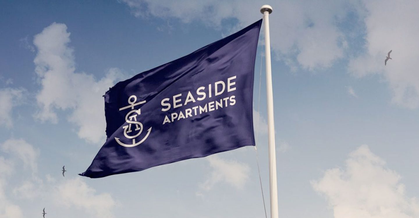 Seaside Apartments logo on flag