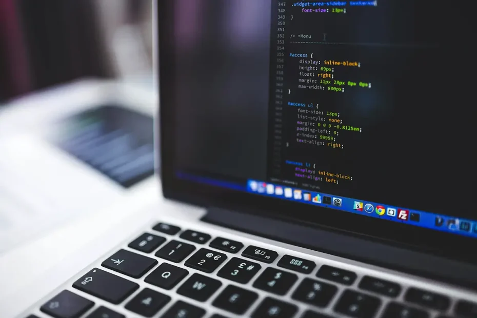 Close up of a Macbook with CSS-syntax visible on the screen.